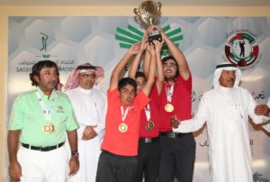 The 15 & Under UAE National Golf Team lifting the 1st Place Trophy while wearing their Gold Medals